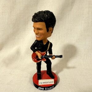 Black and Red Guitarist Figurine